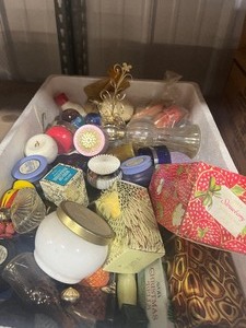 lot 60 image: Box full of unique little bottles and avon