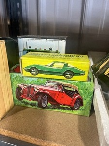 lot 63 image: Shelf Full of automotive avon bottles all different cars and trucks