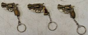 lot 28 image: (3) Mini Gun Shaped Knives (View Photos)
