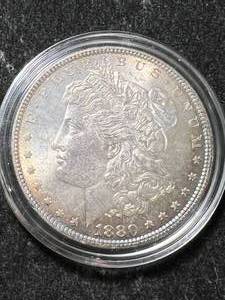 lot 25 image: 1880 US MORGAN SILVER DOLLAR IN AIRTITE