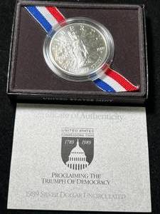 lot 111 image: 1989 US DEMOCRACY COMMEM SILVER DOLLAR