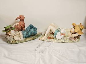 lot 45 image: Capodimonte Figurers  Sleeping Girl with Cat & Napping Boy with Dog