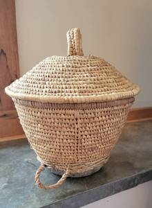 lot 122 image: African Sweet Grass Lidded Basket with Animal Hide Bottom