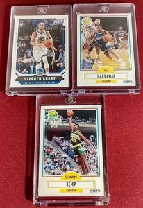 lot 251 image: (3) Basketball Star Cards in One Touch Cases