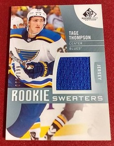 lot 57 image: 2017-18 SP Tage Thompson Rookie Sweaters Card - #d199