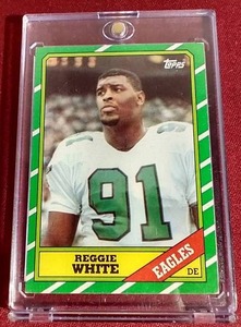 lot 63 image: 1986 Topps Reggie White Rookie Card