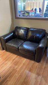 lot 55 image: Used Black Vinyl Leather Loveseat Couch
