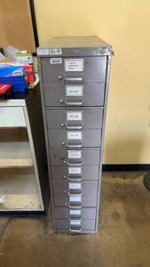 lot 812 image: Metal Cabinet with Bicycle Spokes Assortment
