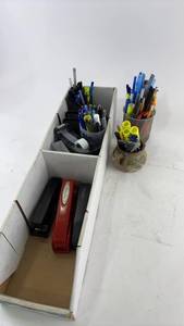 lot 912 image: Assorted Office Supplies Collection including Staplers and Writing Instruments