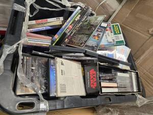 lot 98 image: A 20W Tote full of over 200 combined of DVDs, CDs, and Cassettes