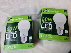 lot 163 image: Lot of 8 LED Greenlite 60W Equivalent Light Bulbs (4 packs in each of the two boxes) New