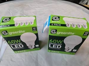 lot 166 image: Lot of 8 LED Greenlite 60W Equivalent Light Bulbs (4 packs in each of the two boxes) New