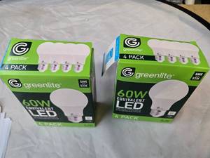 lot 167 image: Lot of 8 LED Greenlite 60W Equivalent Light Bulbs (4 packs in each of the two boxes) New