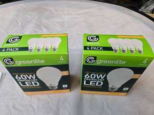 lot 179 image: Lot of 8 LED Greenlite 60W Equivalent Light Bulbs (4 packs in each of the two boxes) New