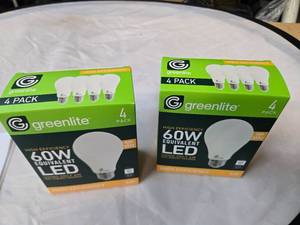 lot 184 image: Lot of 8 LED Greenlite 60W Equivalent Light Bulbs (4 packs in each of the two boxes) New