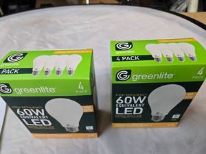 lot 185 image: Lot of 8 LED Greenlite 60W Equivalent Light Bulbs (4 packs in each of the two boxes) New