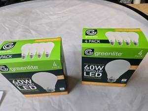 lot 186 image: Lot of 8 LED Greenlite 60W Equivalent Light Bulbs (4 packs in each of the two boxes) New