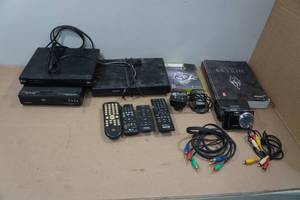lot 243 image: Assorted Electronics -DVD Players, Remotes, Camera