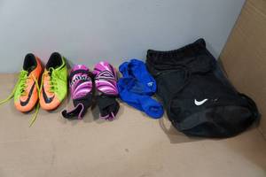 lot 248 image: Nike Bag with Size 6Y Soccer Cleats and Shin Pads