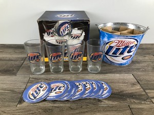 lot 37 image: Miller Lite 20 Piece Bucket Gift Set - 4 Glasses - Metal Bucket & 15 Coasters