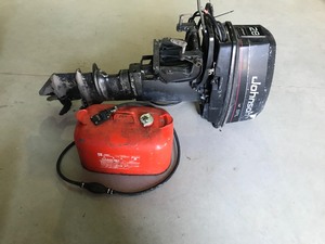 lot 149 image: Johnson 28 hp Outboard Boat Motor with Metal 5 Gallon Gas Tank