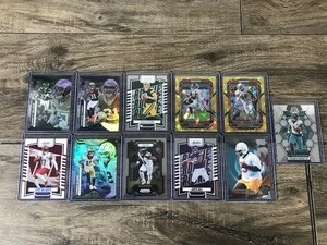 lot 390 image: Lot of 11 Football Cards - Warren Sapp - Jaren Hall - Nolan Smith and More
