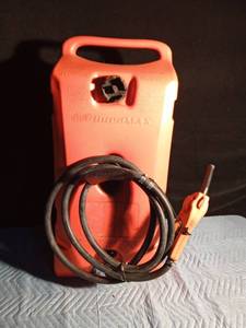 lot 135 image: Dura Max gas can on wheels with hose and nozzle