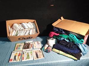 lot 175 image: Box of smoke free material and a box of womens clothes patterns