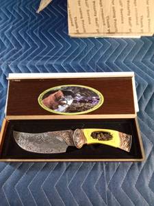 lot 167 image: Hunting knife with bears on the handle and etching on the blade