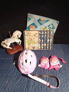 lot 279 image: Kids Barbie bike gear, porcelain carousel horse, a kit of shells, childrens fun camera