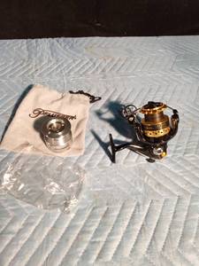 lot 208 image: DU 3000 Fishing reel and a Pflueger fishing reel new spool