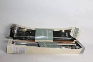 lot 8 image: American Standard Williamsburg 24 Towel Bar with Brass Accent Pieces