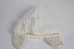 lot 67 image: Handmade White Knit Baby Hat with Pom Pom