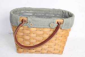 lot 105 image: Longaberger Handmade Woven Basket with Green Cloth Liner