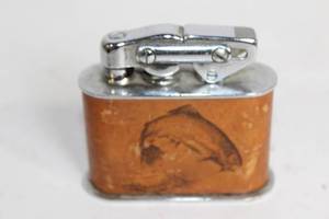 lot 192 image: Vintage Leather-Wrapped Table Lighter with Fish Engraving