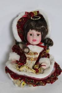 lot 319 image: Decorative Porcelain Doll in Festive Red Outfit with Fur Trim