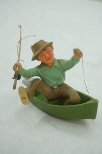 lot 528 image: Vintage Resin Fisherman & Boat-1978 Wilton
