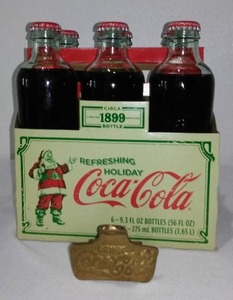 lot 603 image: Coca-Cola, Coke  Vintage Brass Bottle Opener With1886 Replica Bottles (6)