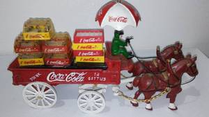 lot 624 image: Coca-Cola, Coke  Vintage Cast Iron Horse Drawn Wagon, Umbrella And Coke Case Delivery.