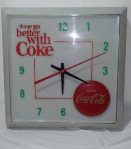 lot 667 image: Coca-Cola, Coke  Vintage Things Go Better With Coke Lighted Clock