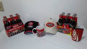 lot 700 image: Coca-Cola, Coke NASCAR Collectible Hats, Mug, Bottles.