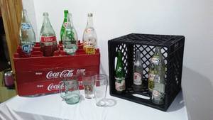 lot 702 image: Coca-Cola, Coke Plastic 2 L Holders, Crate And Variety Of Bottles And Glasses.
