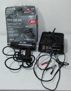 lot 823 image: Battery Charger and Heat Gun.