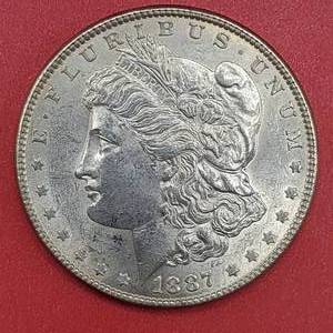 lot 15 image: 1887 Morgan Silver Dollar Higher Grade