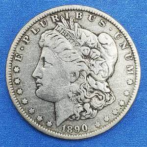 lot 17 image: 1890-O Morgan Silver Dollar