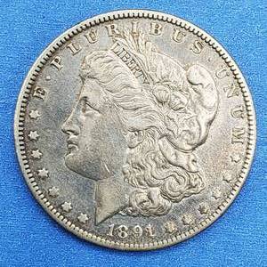 lot 21 image: 1891-O Morgan Silver Dollar Higher Grade