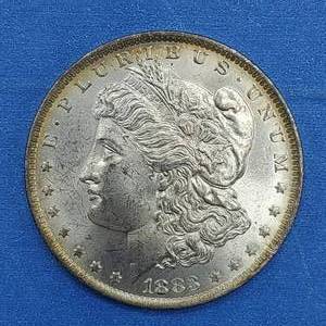 lot 26 image: 1883-O Morgan Silver Dollar Higher Grade