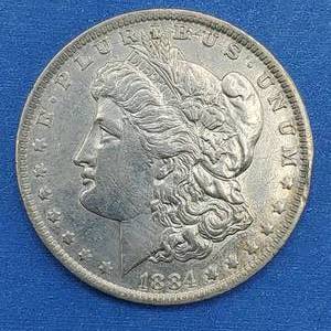 lot 27 image: 1884-O Morgan Silver Dollar Higher Grade