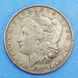 lot 32 image: 1904 Morgan Silver Dollar Nice Grade