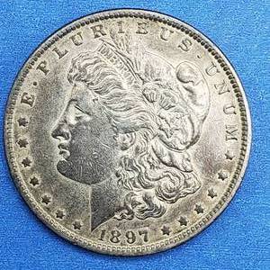 lot 39 image: 1897-O Morgan Silver Dollar Higher Grade